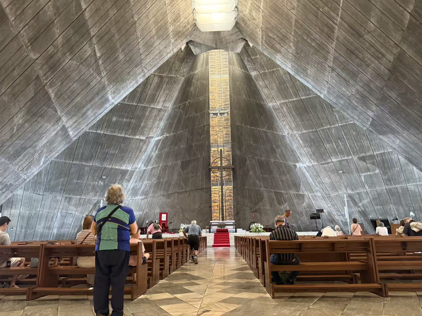 Pilgrims visiting a striking modern Catholic church in Japan