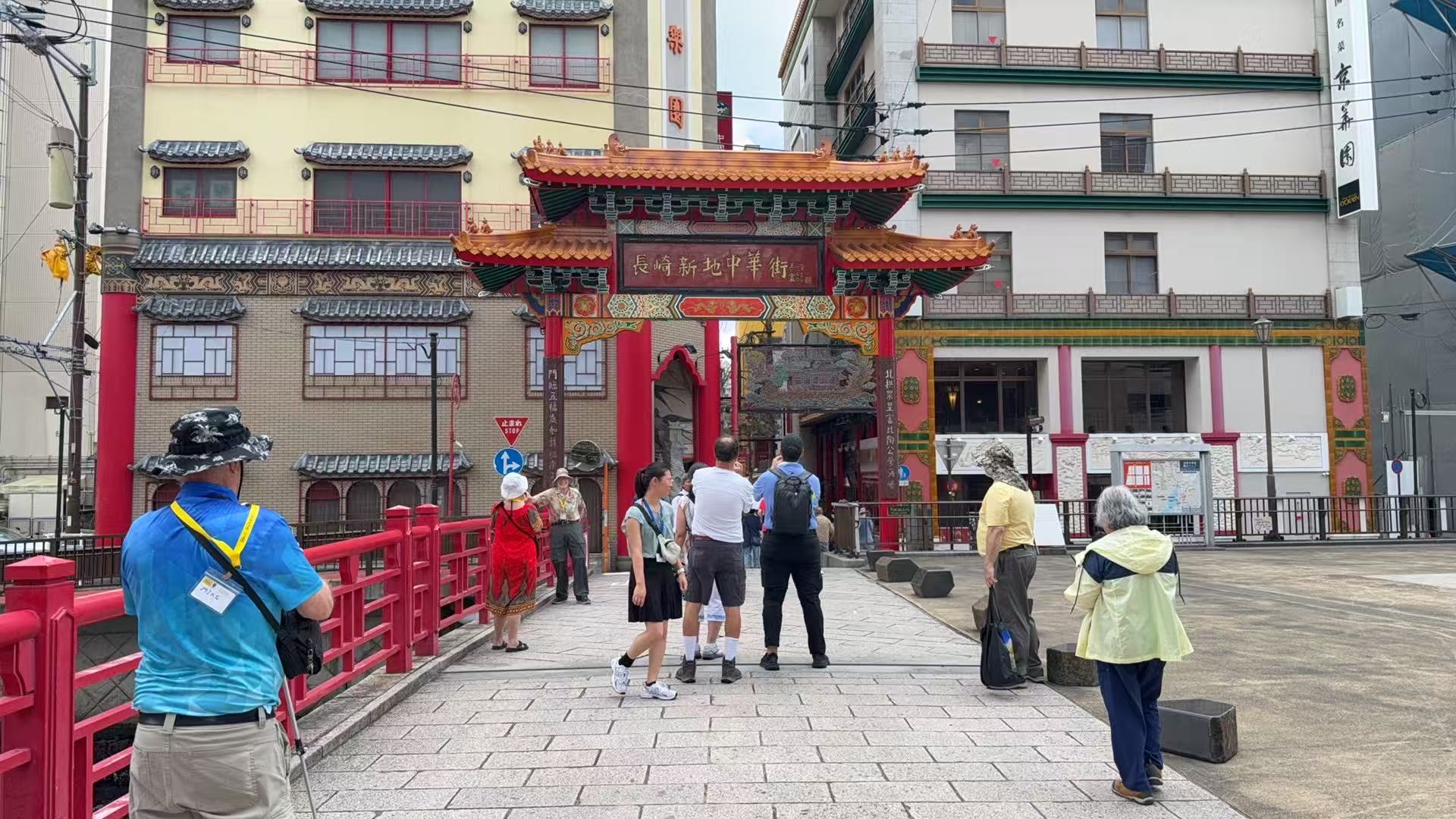 Pilgrims walking toward the entrance gate of Nagasaki Shinchi Chinatown